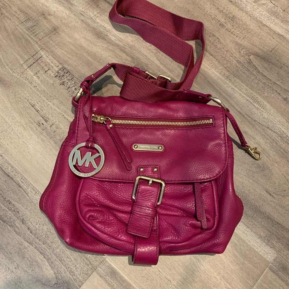 Woman’s Purple Michael Kors Crossbody purse